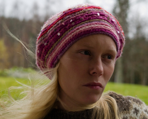 Crocheted magenta beanie hat