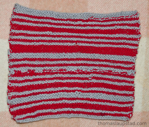 striped red and grey hand knitted wash cloth